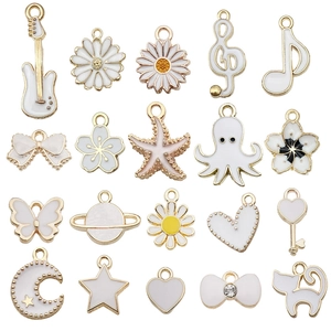 Set of 20 white enamel charms featuring music notes and guitar shapes for DIY jewelry