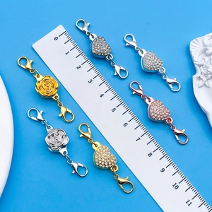 Detail view of heart and rose magnetic jewelry clasps with double lobster claws and rhinestones