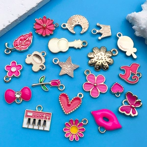 DIY charm assortment featuring hot pink enamel alloy hearts, butterflies, and crowns