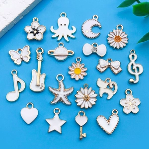 White enamel alloy charms set featuring musical notes and floral motifs for DIY jewelry
