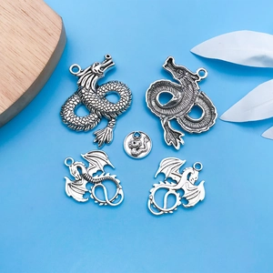 Detailed set of antique silver dragon charms for DIY jewelry making and necklace crafts