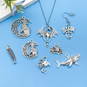 Vintage silver animal pendants set including shark, snake, and dragon for DIY jewelry making