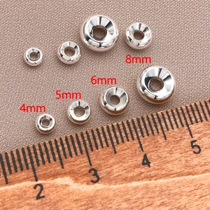 Close-up of 18K gold plated spacer beads in 4mm to 8mm sizes for DIY jewelry