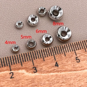 Close-up of 18K gold plated copper spacer beads in 4mm to 8mm sizes for jewelry