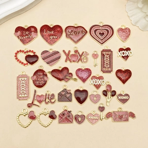 Pink and red enamel heart charms set in gold finish for DIY jewelry and crafts