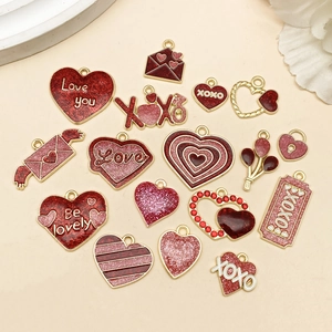 Detail of pink and red enamel rose heart charms for Valentine's DIY jewelry crafts