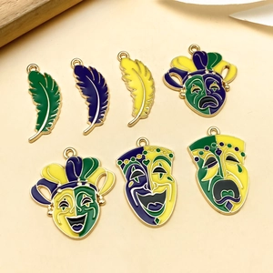 7Pcs Mardi Gras charms set featuring enamel feathers and theater masks in vibrant colors