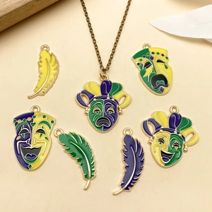 Golden Mardi Gras charms set with enamel masks and feathers for DIY jewelry making