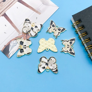 Gothic skull butterfly pendants set in gold-tone alloy for DIY jewelry and keychains