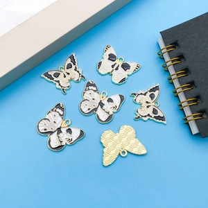 Set of 6 gothic butterfly skull enamel charms with golden edges and metal backs