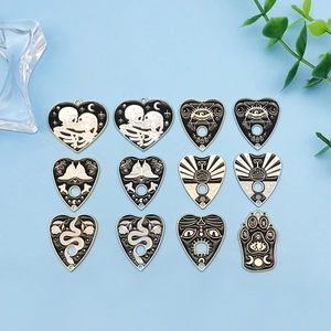Set of 12 Gothic enamel alloy charms featuring mystical eye and moth designs for DIY jewelry