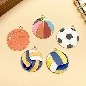 Detailed macro view of colorful enamel ball pendants for DIY jewelry making