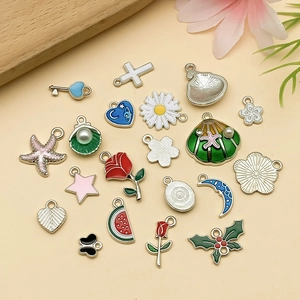 Collection of white gold flower and butterfly enamel charms for DIY jewelry making