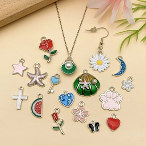 DIY colorful enamel charms set featuring flowers, butterflies, and stars for bracelets