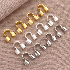 Detailed view of U-shaped 18K gold plated horseshoe connectors for DIY jewelry making
