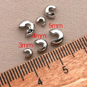 Close-up of 18K gold plated C-type crescent crimp beads in 3mm 4mm 5mm sizes for DIY jewelry