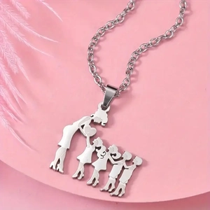 Detailed macro view of silver family silhouette pendant necklace on elegant pink display