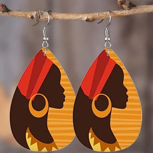 Ethnic teardrop acrylic earrings featuring African woman portrait on a rustic wood branch