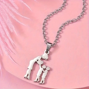 Macro view of polished family silhouette pendant with mother and child on O-chain necklace