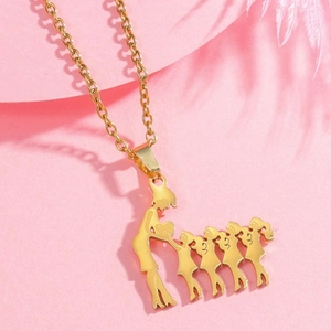 Close-up of golden stainless steel family pendant showing mother and five children silhouette