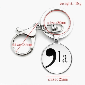 Silver lobster clasp keychain with glass pendant featuring a semicolon and la design