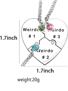 Detail of three-piece heart puzzle necklaces with colorful rhinestones and Weirdo engraving