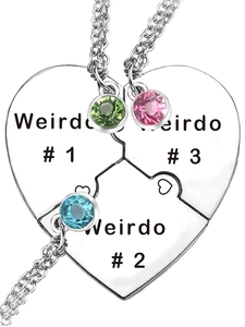 Close-up of heart puzzle necklaces set for three friends with colorful rhinestones