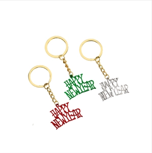 Three-piece Happy New Year keychain set in red green and silver metal hollow design