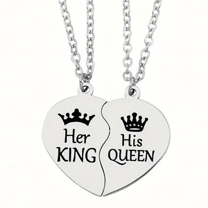 Detail of stainless steel puzzle heart pendants with Her King and His Queen engravings