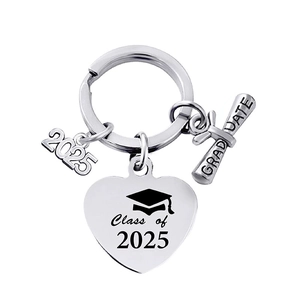 Macro detail of 2025 graduation keychain with heart pendant and mortarboard cap charm