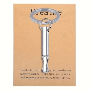 Silver meditation breathing tool keychain with cardboard packaging for stress relief