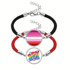 Detail of two-piece woven cord bracelets with rainbow glass pendants and metal lobster clasps