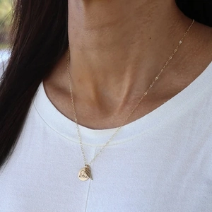 Gold stainless steel necklace featuring DAD engraved round disc and angel wing pendants