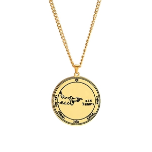 Detailed view of golden Solomon talisman pendant with Hebrew engraving and hexagram