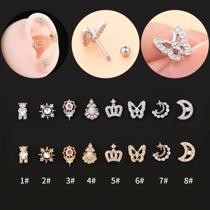 Detailed views of geometric cubic zirconia ear studs featuring crown and bow designs