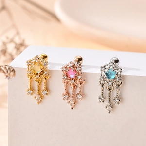 Detailed view of cubic zirconia star earrings in gold, rose gold and silver finishes