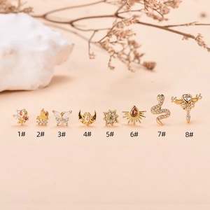 Set de pendientes vintage dorados con mariposa, serpiente y detalles de circón