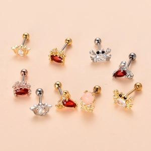 Detailed macro view of colorful zircon sea creature cartilage earrings in rose gold finish