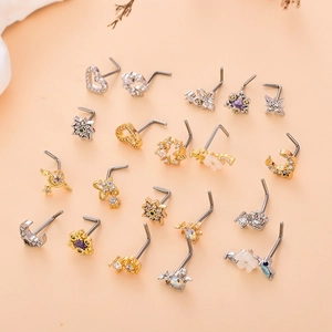 Detailed set of L-shaped nose studs in heart and moon shapes with shiny zircon stones