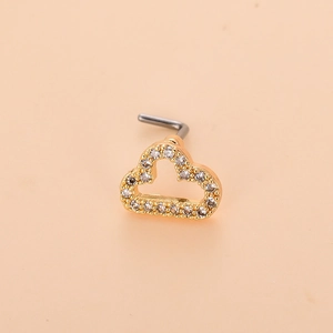 Detailed view of L-shaped nose stud featuring a gold cloud set with sparkling cubic zirconia