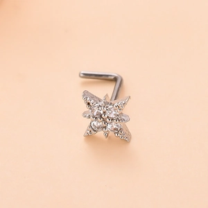 Close-up of star-shaped nose stud with micro-paved zircons and fine milgrain detail
