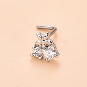 Close-up of L-shaped silver nose stud featuring a flower design and white cubic zirconia