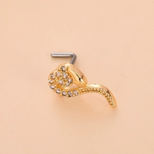 Detailed view of a gold snake nose stud featuring sparkling zircon pavé and an L-shaped post