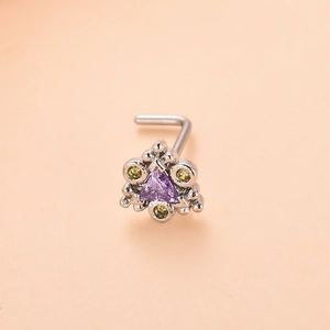 L-shaped nose stud featuring a purple triangle zircon and green gemstones in a flower design