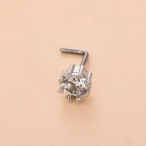 Detailed macro view of L-shaped silver nose stud featuring a prong-set clear zircon stone