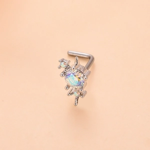 Detailed close-up of L-shaped nose stud with sparkling opal-like stone and cubic zirconia