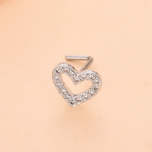 Detailed view of silver heart L-bend nose stud with micro-pave white zircon crystals