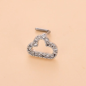 Close-up of cloud-shaped piercing jewelry with sparkling pave-set cubic zirconia stones