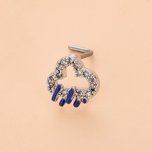 Detailed view of silver cloud nose stud with pavé crystals and blue drip oil raindrops