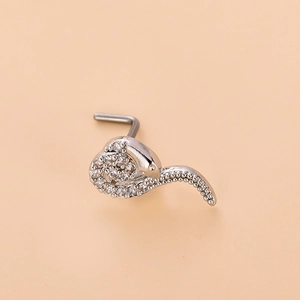Detailed close-up of a silver L-shaped nose stud featuring a snake-shaped design with cubic zirconia
